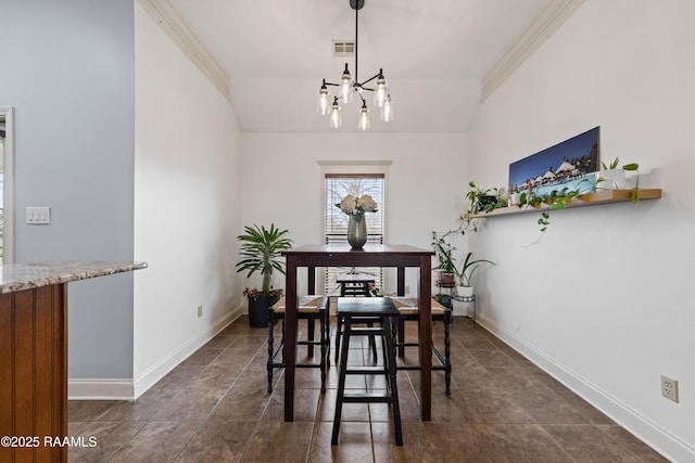 dining area featuring ornamental molding, a chandelier, and vaulted ceiling