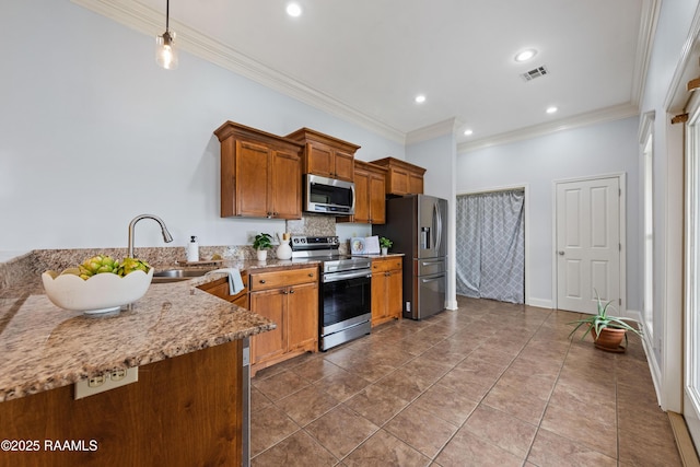 kitchen featuring stainless steel appliances, crown molding, light stone counters, and sink