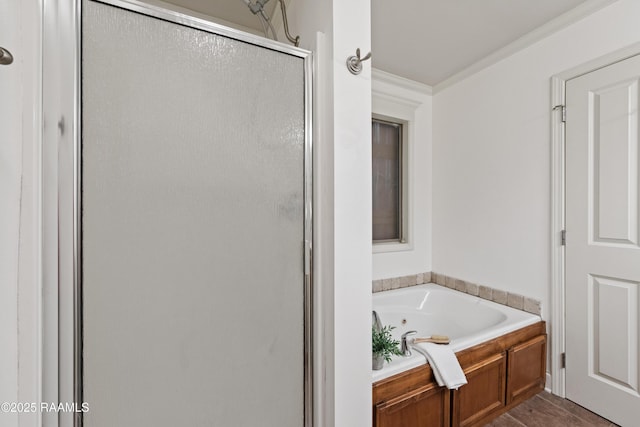 bathroom with crown molding and plus walk in shower