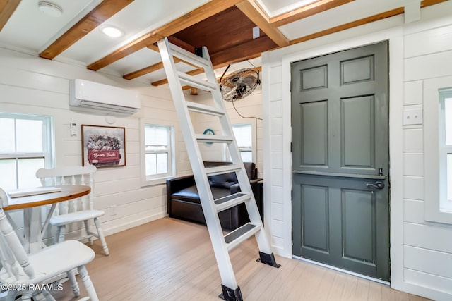 interior space featuring a wall mounted AC and a porch