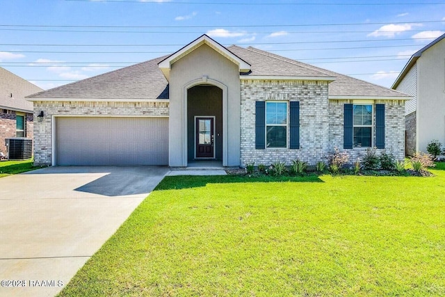 view of front of house featuring a garage, a front lawn, and cooling unit