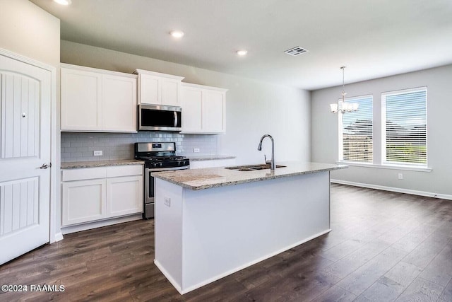 kitchen featuring white cabinetry, an island with sink, stainless steel appliances, and sink