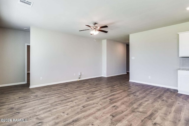 unfurnished living room featuring ceiling fan and light wood-type flooring