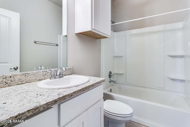 full bathroom with vanity, toilet, and washtub / shower combination