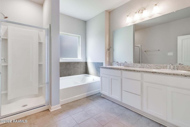 bathroom featuring tile patterned floors, separate shower and tub, and vanity