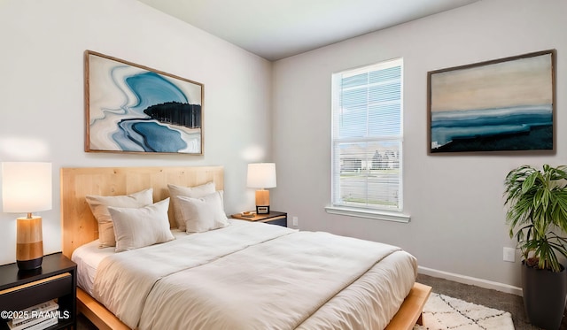 bedroom featuring dark carpet