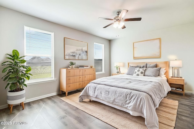 bedroom with ceiling fan and hardwood / wood-style floors