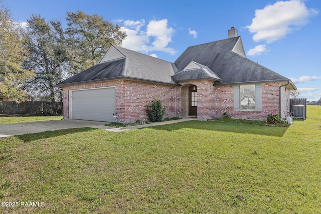 view of front facade featuring a garage and a front lawn