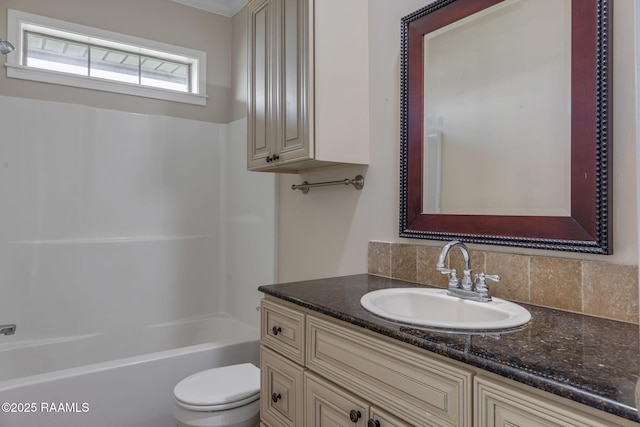 full bathroom with vanity, toilet, tasteful backsplash, and bathing tub / shower combination