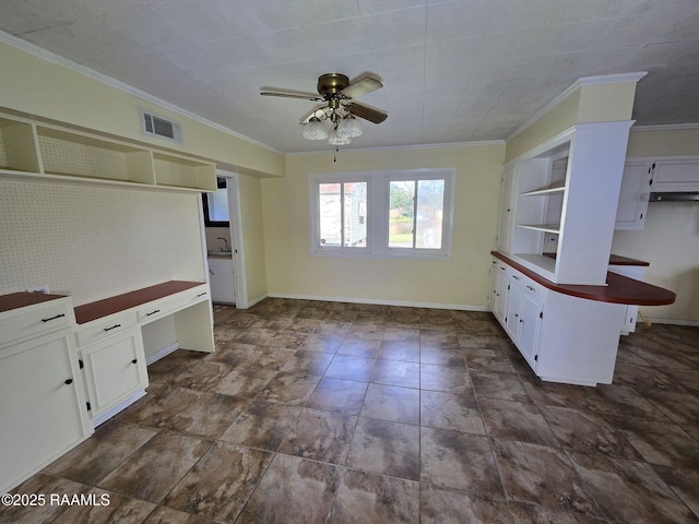 kitchen featuring white cabinets, kitchen peninsula, ceiling fan, and ornamental molding