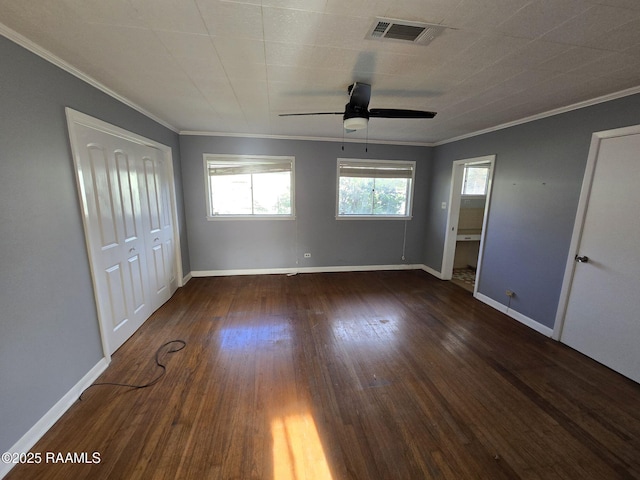 unfurnished bedroom with a closet, ceiling fan, dark hardwood / wood-style flooring, and crown molding