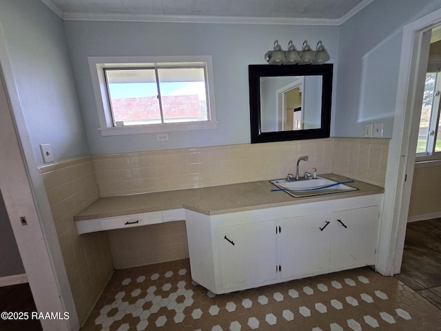 bathroom with tile patterned floors, vanity, ornamental molding, and tasteful backsplash