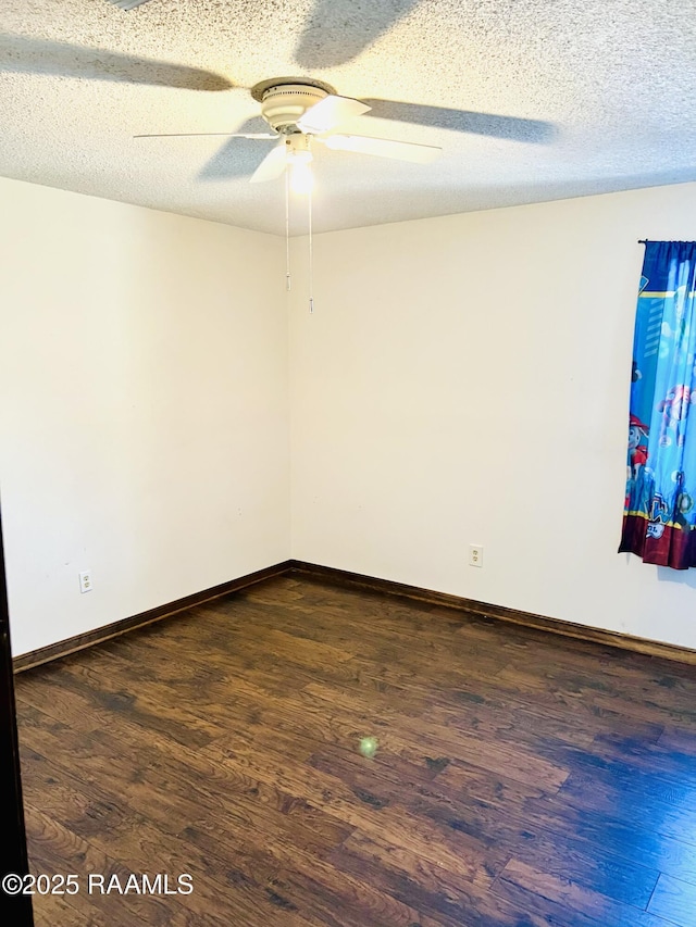 unfurnished room featuring ceiling fan, a textured ceiling, and dark hardwood / wood-style flooring