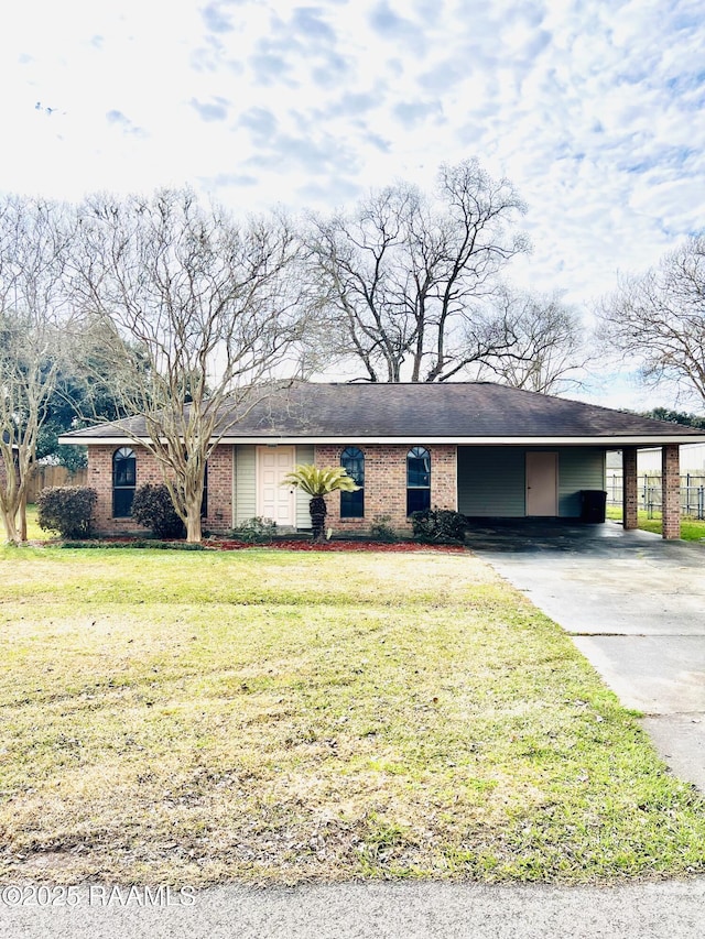 ranch-style house with a carport and a front yard