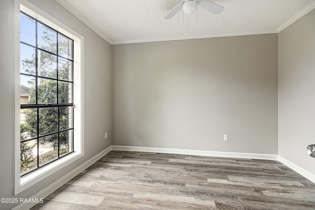 unfurnished room featuring ceiling fan, ornamental molding, plenty of natural light, and light wood-type flooring