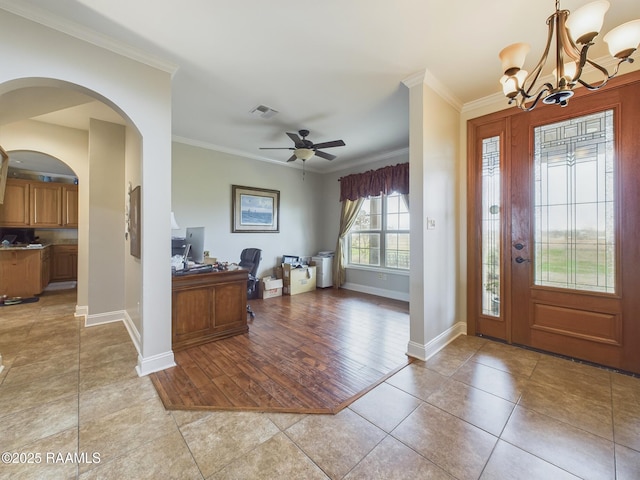 entrance foyer featuring crown molding, light tile patterned floors, visible vents, baseboards, and ceiling fan with notable chandelier