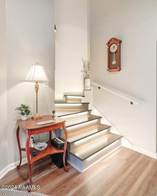 stairway featuring hardwood / wood-style floors