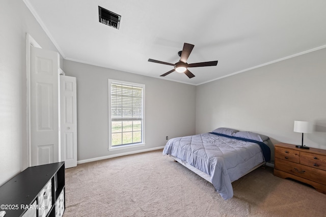 carpeted bedroom featuring ceiling fan and ornamental molding