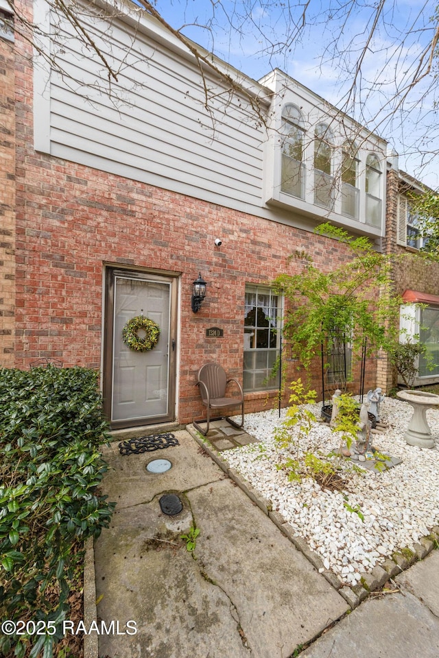 doorway to property with a patio