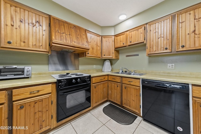 kitchen featuring black appliances, light tile patterned flooring, and sink