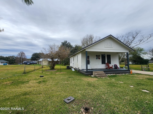 view of front of home with a front lawn and a porch