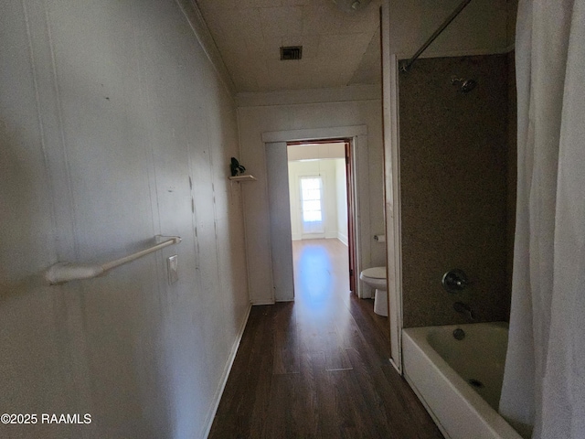 interior space with visible vents, dark wood finished floors, and baseboards