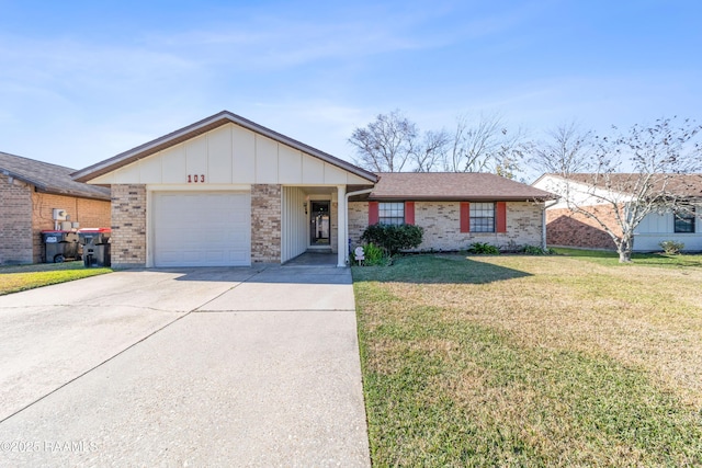 ranch-style home featuring a front lawn and a garage