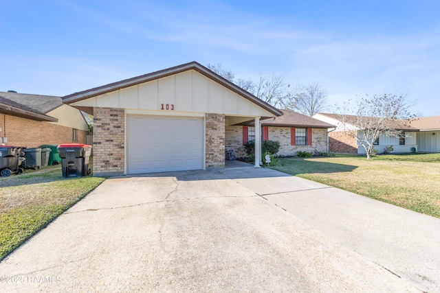 single story home with a front yard and a garage