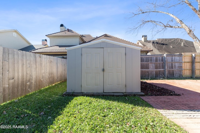 view of outbuilding featuring a yard