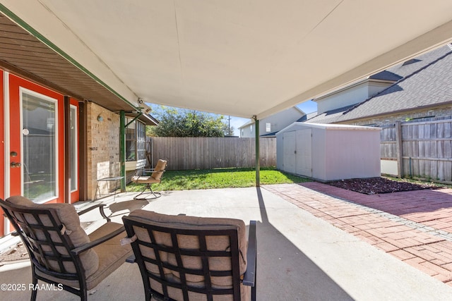 view of patio / terrace with a shed