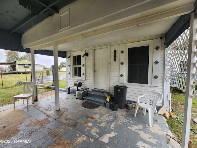 view of patio / terrace featuring entry steps and fence