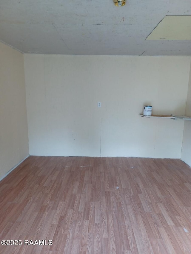 empty room with wood finished floors