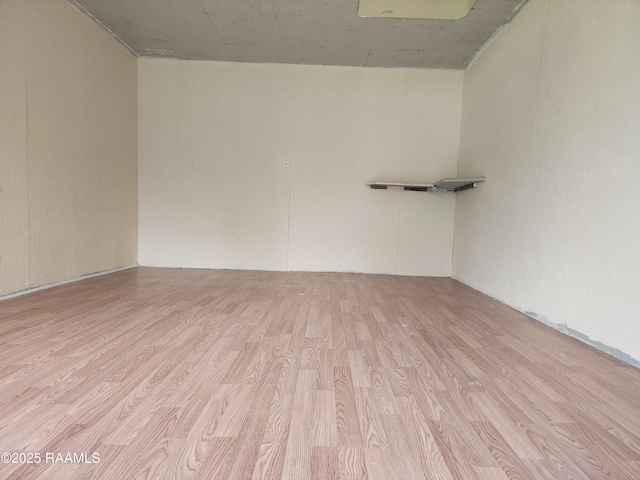 empty room with wood finished floors