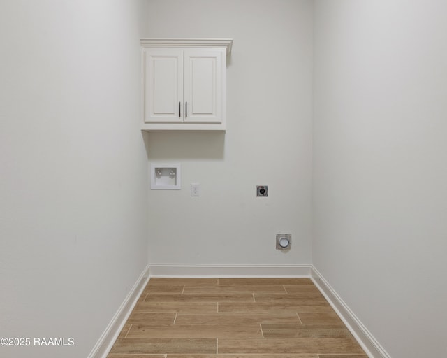 laundry room with hookup for an electric dryer, cabinets, and washer hookup