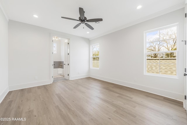 unfurnished room featuring ceiling fan, light wood-type flooring, and ornamental molding