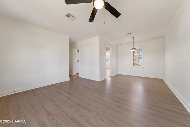 interior space with ceiling fan, crown molding, and dark wood-type flooring