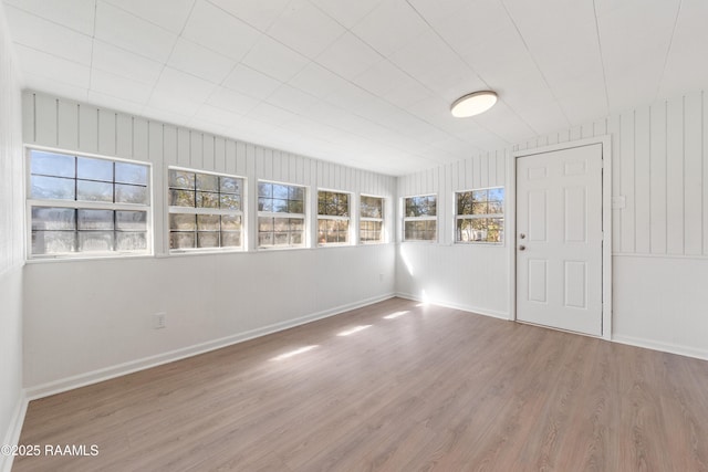 empty room featuring hardwood / wood-style flooring and a wealth of natural light