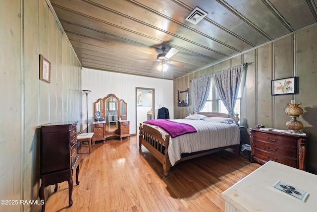 bedroom with ceiling fan and light wood-type flooring