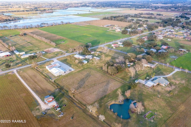 birds eye view of property with a water view and a rural view