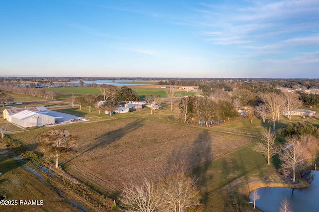 birds eye view of property with a rural view and a water view