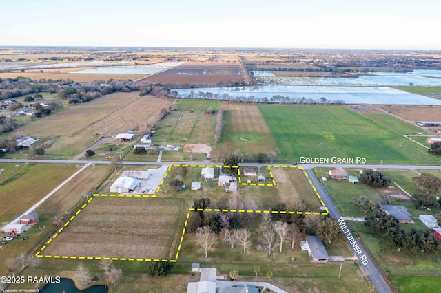 bird's eye view with a water view and a rural view