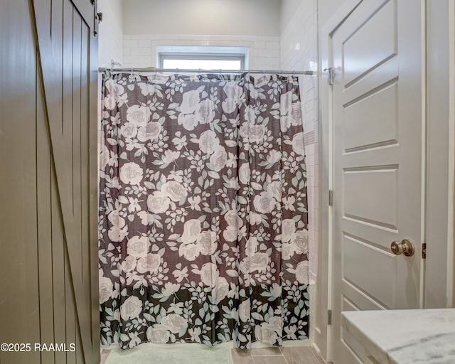 bathroom with curtained shower