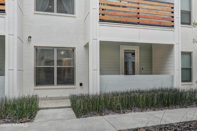 doorway to property featuring a balcony