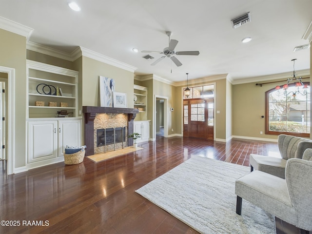 living room featuring ceiling fan, ornamental molding, and dark hardwood / wood-style flooring