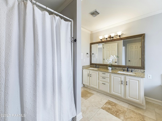 bathroom with tile patterned flooring, crown molding, and vanity