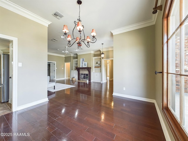 interior space with dark wood-type flooring, crown molding, and a notable chandelier