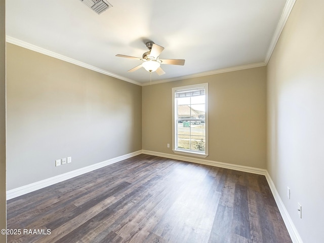 empty room featuring crown molding, dark wood-type flooring, and ceiling fan