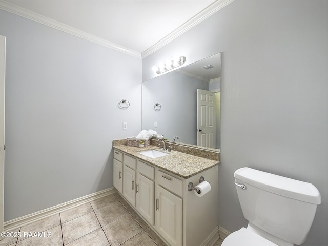 bathroom featuring vanity, tile patterned flooring, ornamental molding, and toilet