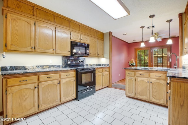 107 W Bayou Shr, Lafayette, LA 70508 - kitchen with black appliances, ceiling fan, light tile patterned floors, decorative light fixtures, and kitchen peninsula