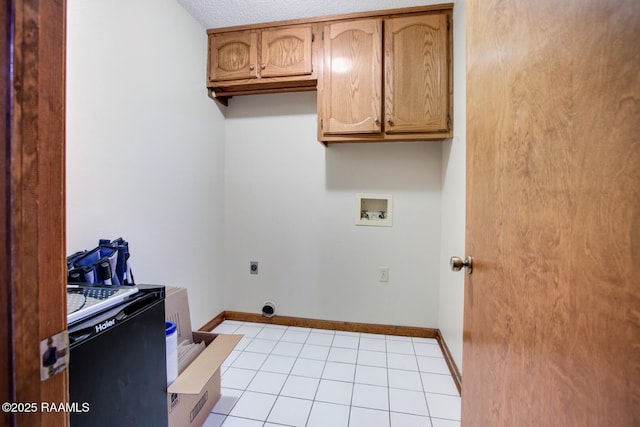 107 W Bayou Shr, Lafayette, LA 70508 - washroom featuring hookup for an electric dryer, light tile patterned floors, a textured ceiling, and hookup for a washing machine
